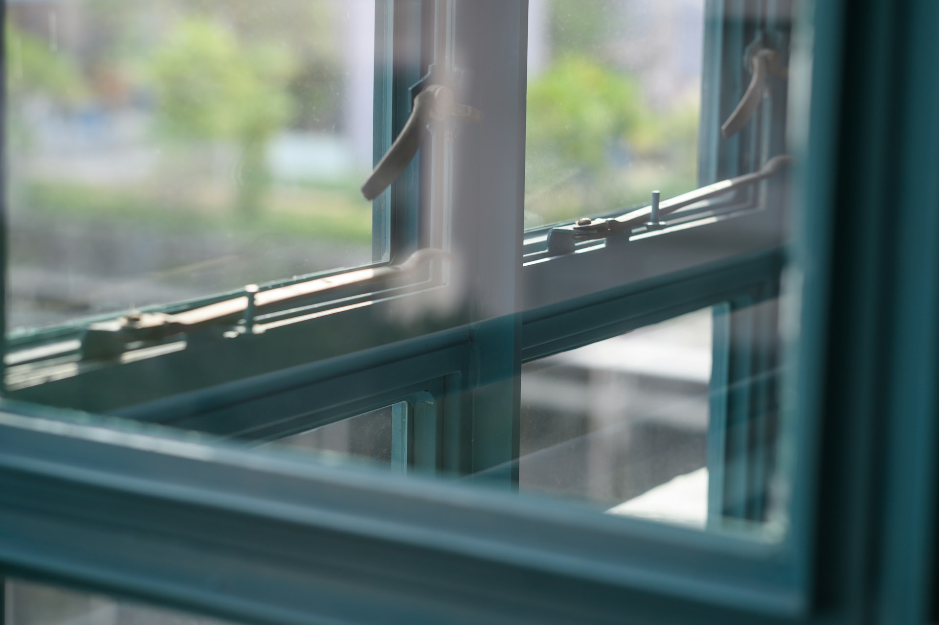 grey metal framed glass window closed